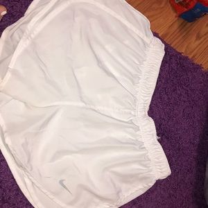 White Nike running shorts
